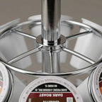 A macro photo focuses on a chrome joint of the Keurig pod carousel, highlighting the smooth metal and fine print quality on the k-cups.
