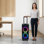 A woman stands next to the 27.5-inch tall Sharp PS-935 portable speaker to show its scale.