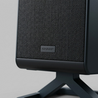 Macro photo of SHARP HT-SPR52021-BK speaker showcasing detailed grille fabric and embossed logo.